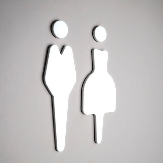 White acrylic restroom sign with male and female symbols