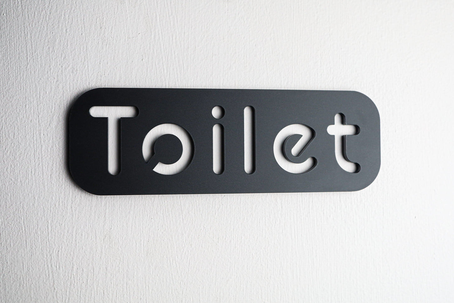 Self-adhesive black acrylic toilet door sign with easy installation