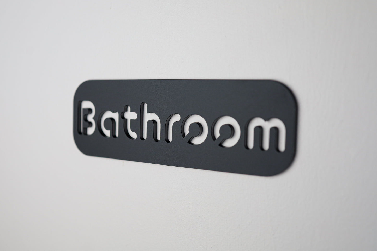 High-quality black "Bathroom" sign with a clean, modern design and cut-out lettering.