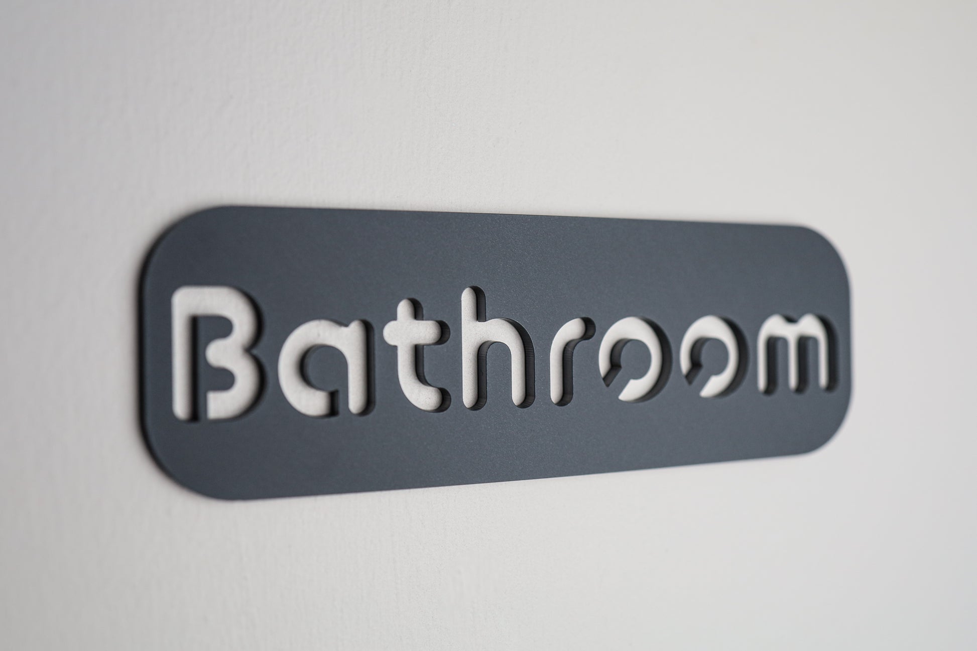 Waterproof bathroom door sign with black letters on grey stone texture acrylic