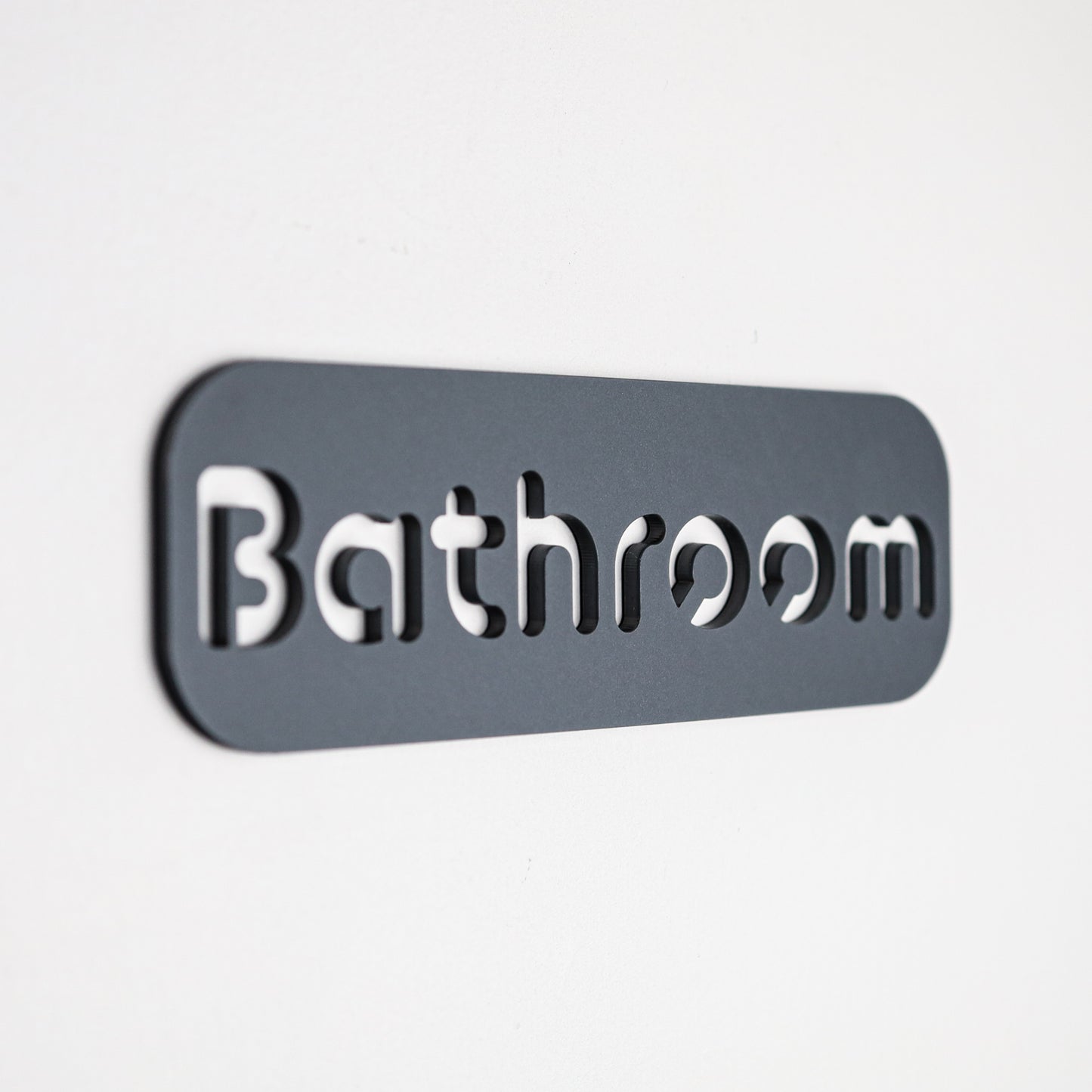 Self-adhesive grey stone texture bathroom sign with minimalist black font