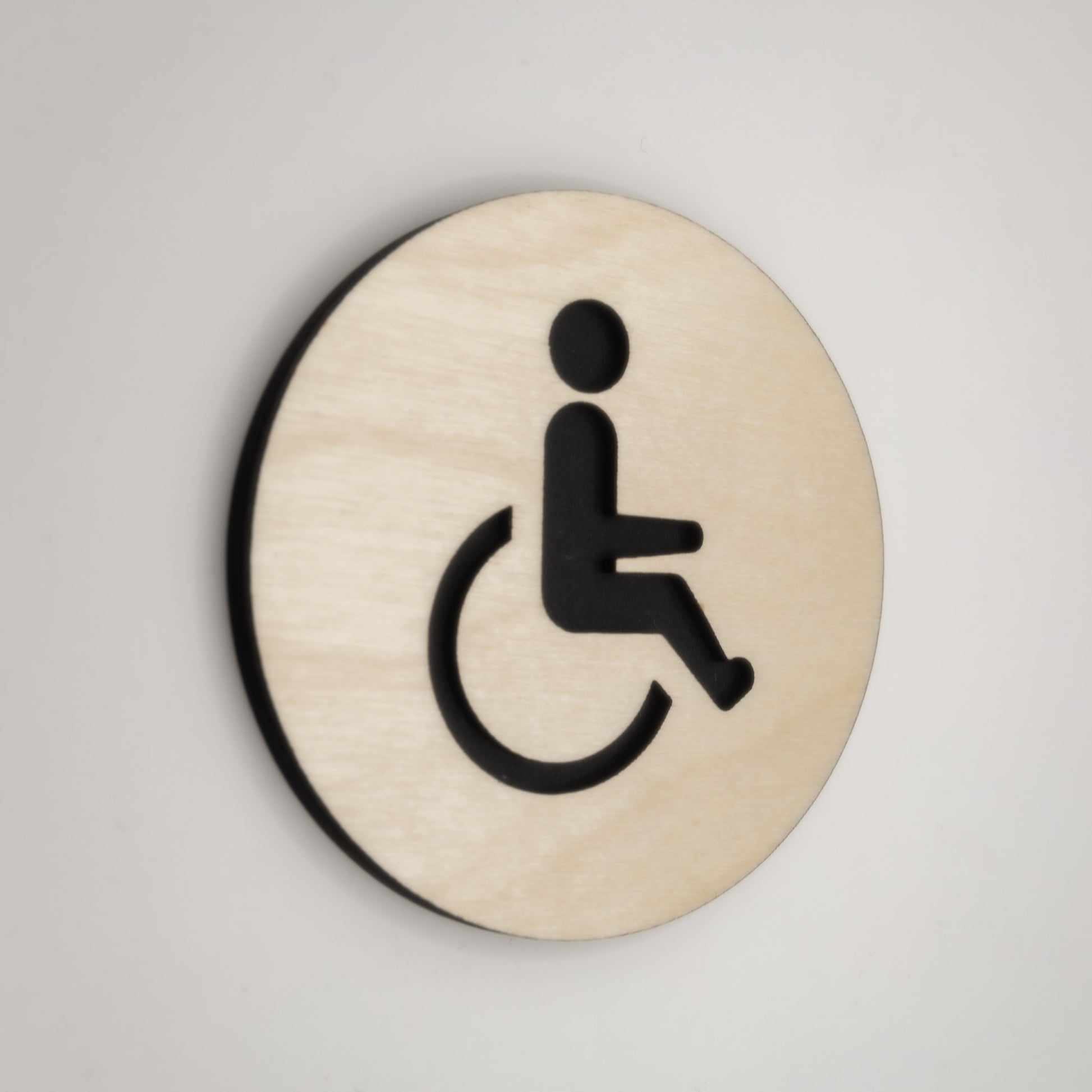 Handicap restroom sign with minimalist design made from plywood and MDF