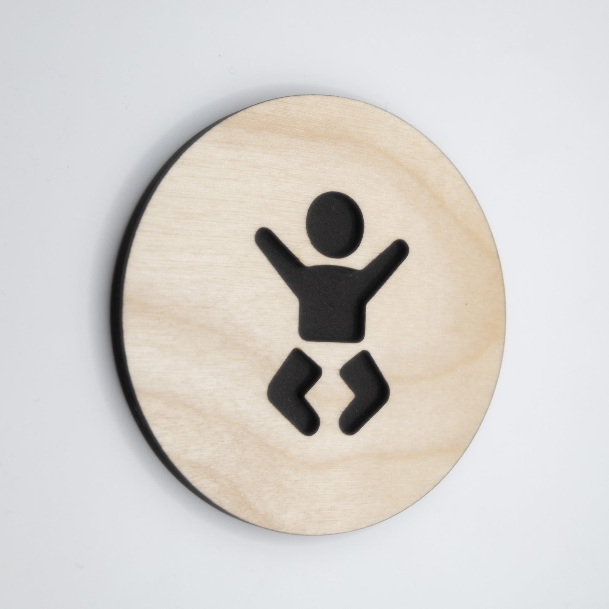 Gender-neutral minimalist door sign for nursery and restroom use.