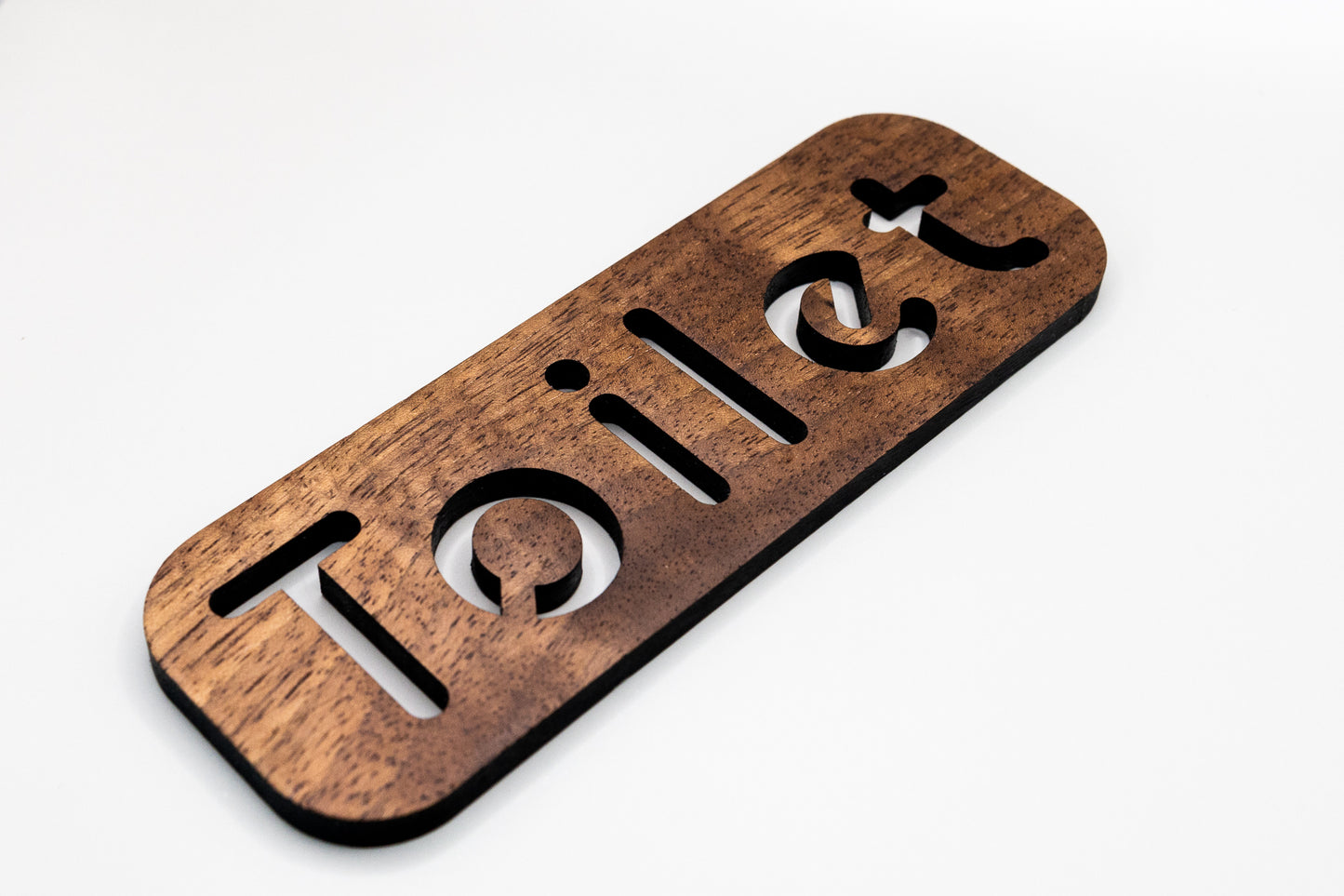 toilet door sign made from walnut reads toilet