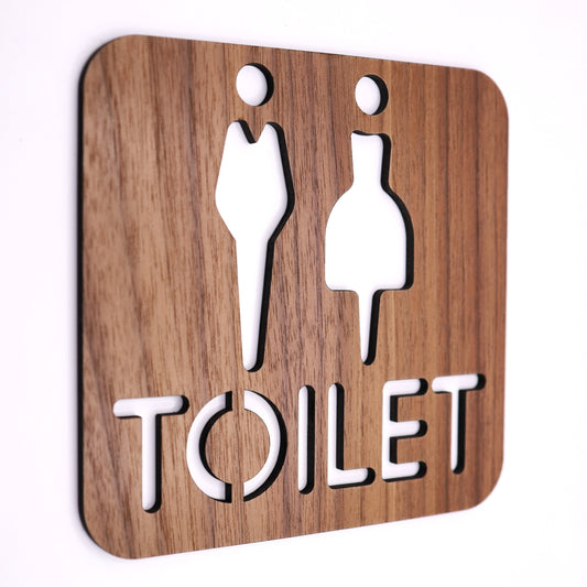 Modern bathroom sign crafted from walnut wood with smooth finish.